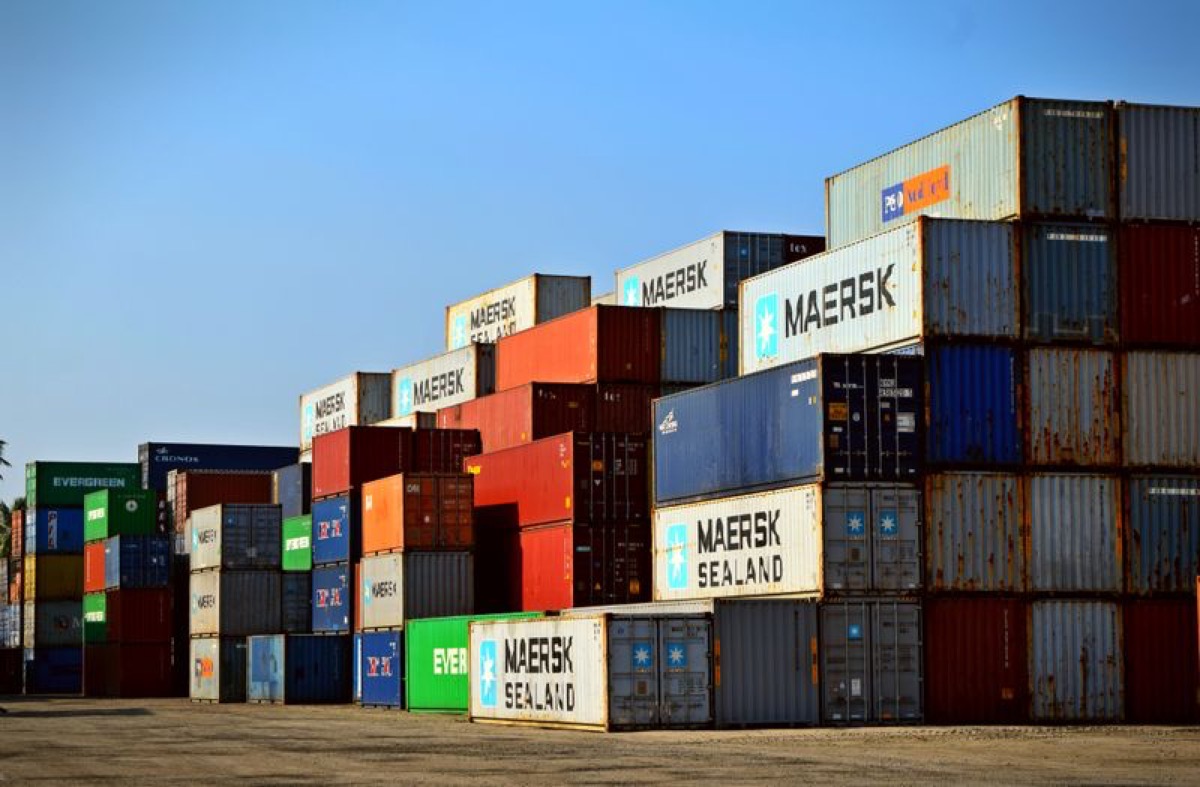 Stacked shipping containers at a logistics yard for industrial goods trade
