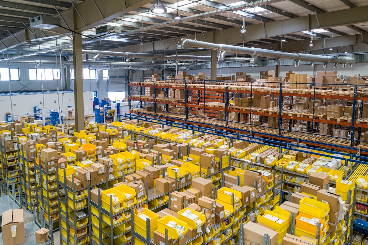 Warehouse aisle with stacked cargo pallets